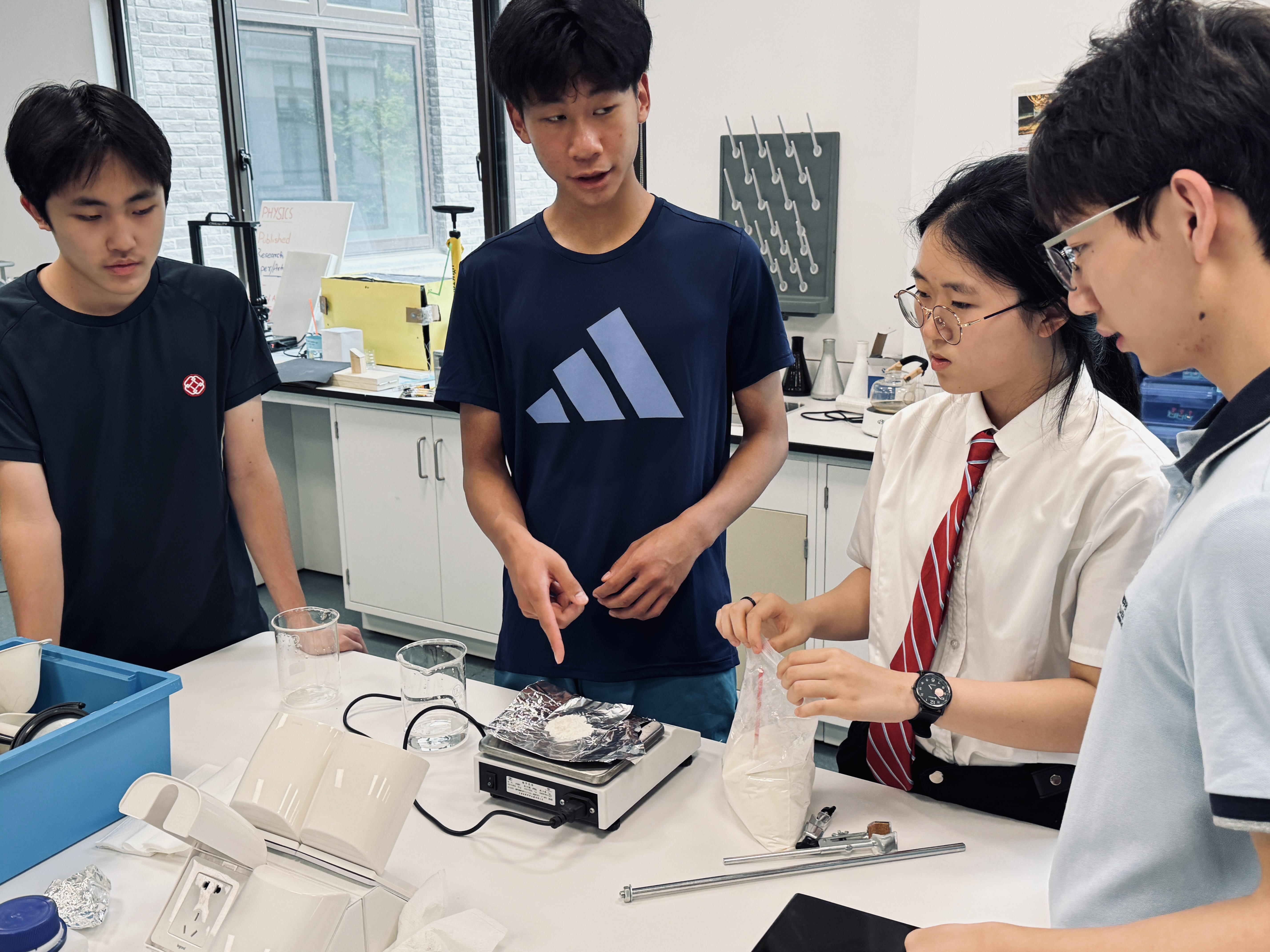 Team weighing chitosan powder and preparing solution